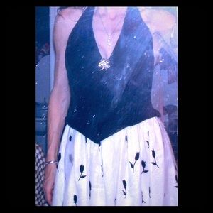 Formal halter neck dress with very full skirt.